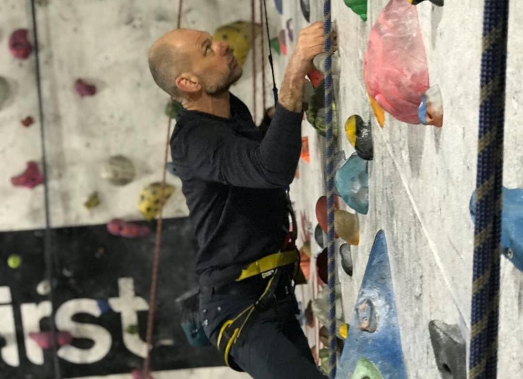 climbing with a fear of heights on an autobelay image showing a picture of a climber with a fear of heights on an autobelay at the climbing wall